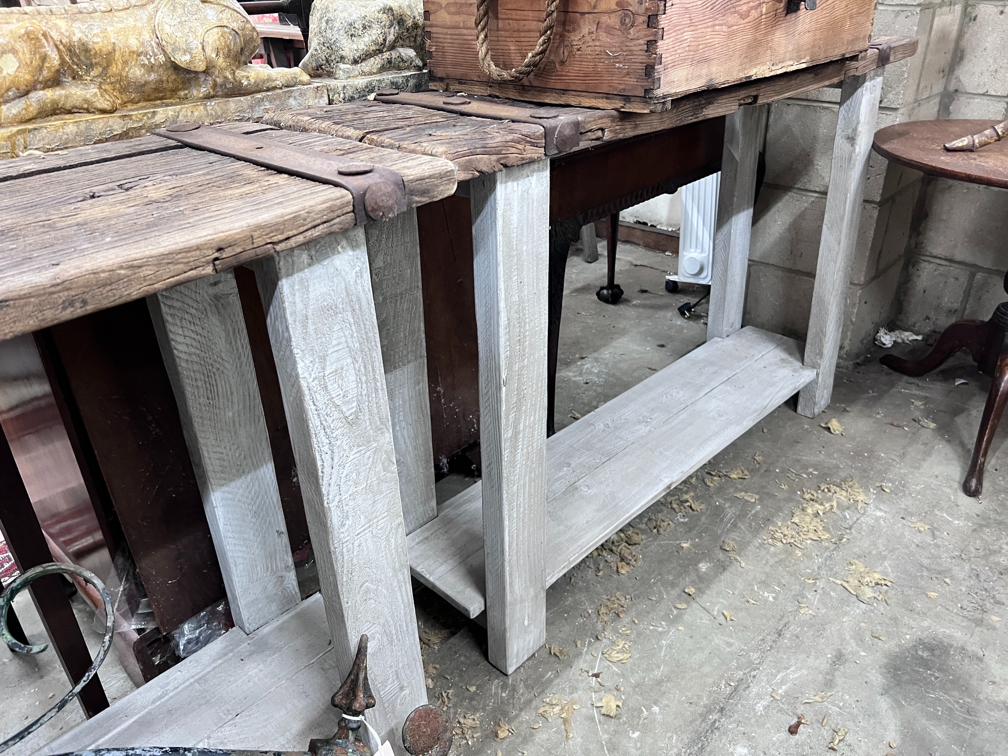 A pair of stained oak console tables with iron bound raw wood tops, width 132cm, depth 40cm, height 87cm *Please note the sale commences at 9am.